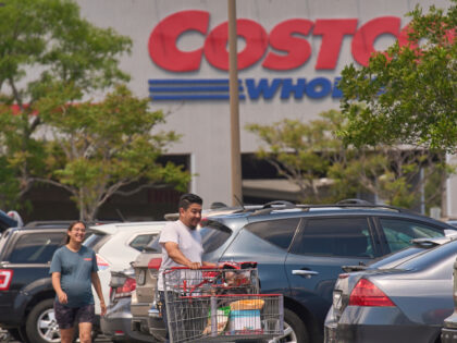 People shop for supplies at Costco Wholesale store in Burbank, Calif., on Thursday, April