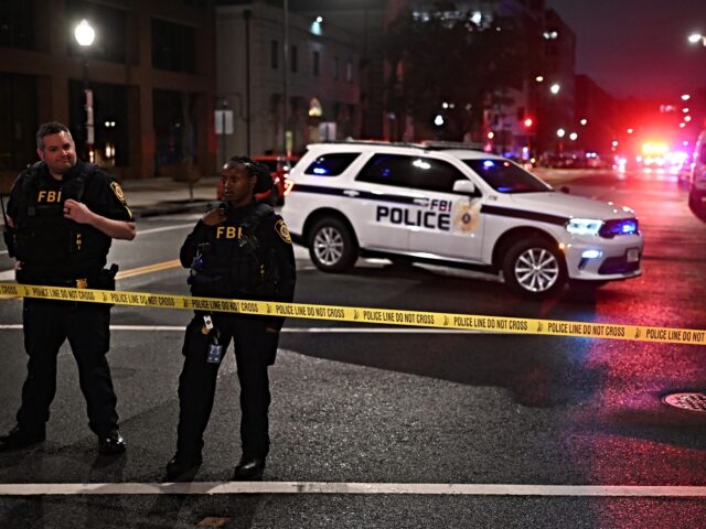 FBI agents cordon off the scene outside the Capital Jewish Museum following a shooting tha