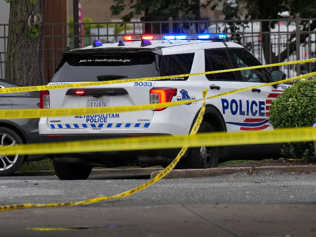 DC Metropolitan police car, crime scene tape Members of Metropolitan Police Department respond to a shooting on H Street Northeast on A