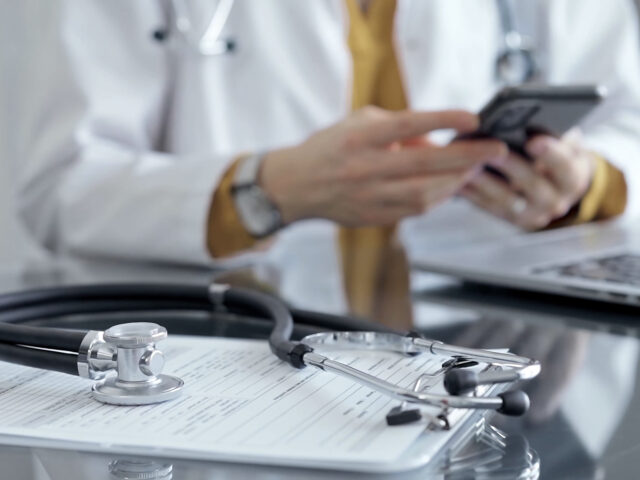 Doctor using cellphone