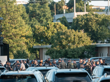 WASHINGTON, DC - AUGUST 11: Federal law enforcement officers gather at a staging facility