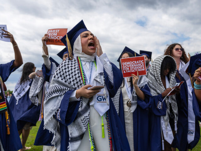 A student shouts slogans during a walkout at the National Mall as President Ellen Granberg