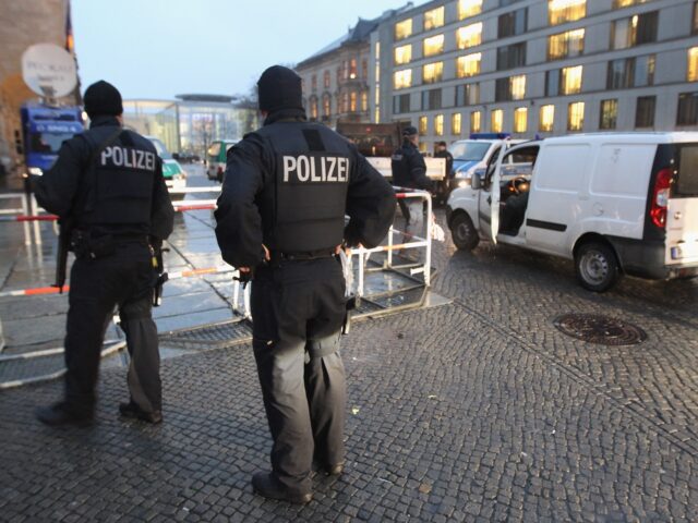 BERLIN - NOVEMBER 22: German police armed with submachine guns check vehicles arriving at