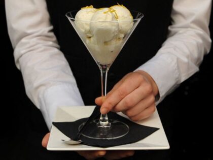 A person holds a portion of a breast milk ice cream named 'Baby Gaga' at the Icecreamists