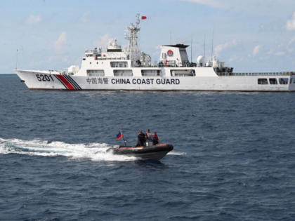 This photo taken on April 23, 2023 shows Philippine coast guard personnel aboard their rig