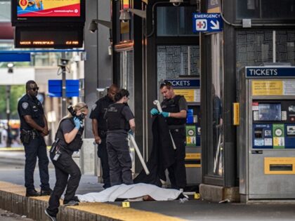 MINNEAPOLIS, MN. - AUGUST 2022: Police investigate a homicide at the 5th Street and Nicoll