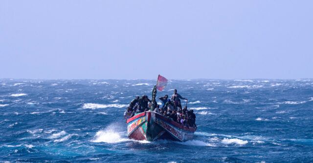 Watch: Tourists Tackle Illegal Boat Migrants Landing on Spanish Beach