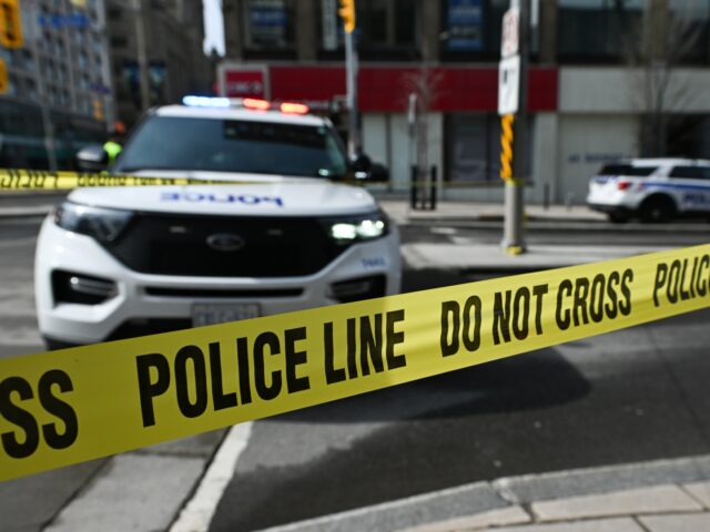 OTTAWA, CANADA APRIL 29: Yellow police tape and Police vehicles are blocking a stretch of