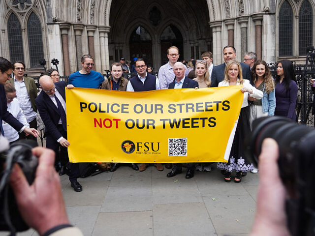 Ray Connolly, supporters and legal team outside the Royal Court of Justice ahead of his wi