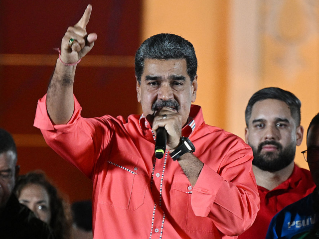 Venezuelan President Nicolas Maduro speaks to supporters as he celebrates the results of t