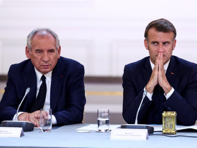 Prime Minister Francois Bayrou (L) and French President Emmanuel Macron attend a meeting w