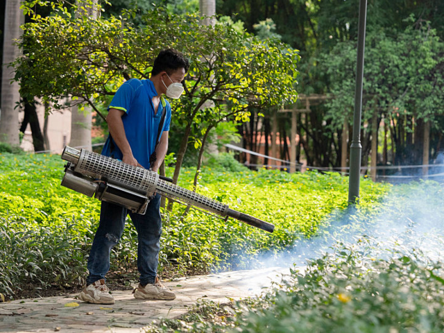 FOSHAN, CHINA - JULY 23: A staff member carries out disinfection work at a hospital amid a