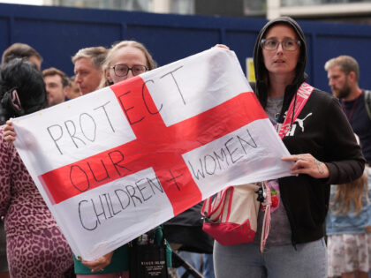 People during a protest near the Britannia International Hotel in Canary Wharf, London whe