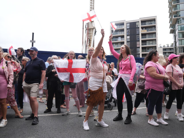 People during a protest near the Britannia International Hotel in Canary Wharf, London whe