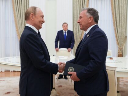 In this pool photograph distributed by the Russian state agency Sputnik, Russia's Pre