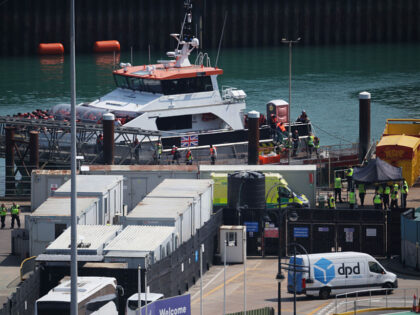 DOVER, ENGLAND - AUGUST 6: The UK Border Force vessel Typhoon brings migrants into Dover p