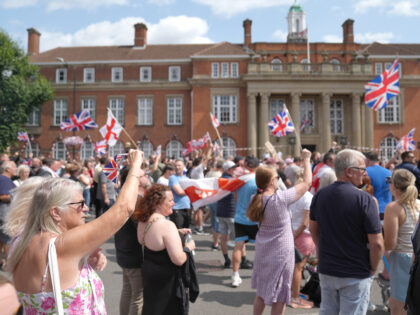 People gather at an anti-immigration protest outside Nuneaton and Bedworth Borough Council