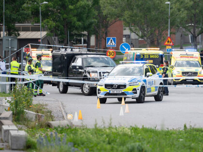 Police work at the scene outside a mosque in Orebro after a shooting where several people
