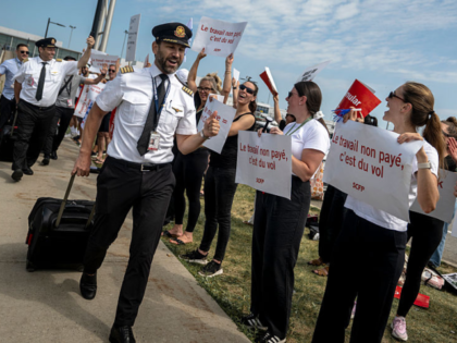 MONTREAL, CANADA - AUGUST 16: Pilots show their support for Air Canada flight attendants p