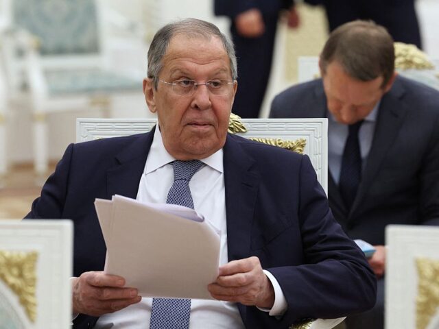 In this pool photograph distributed by the Russian state agency Sputnik, Russia's For