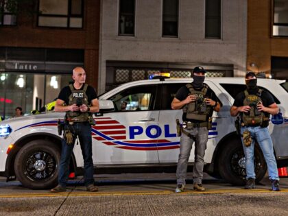 WASHINGTON, DC - AUGUST 13: Police officers set up a roadside checkpoint on 14th street No