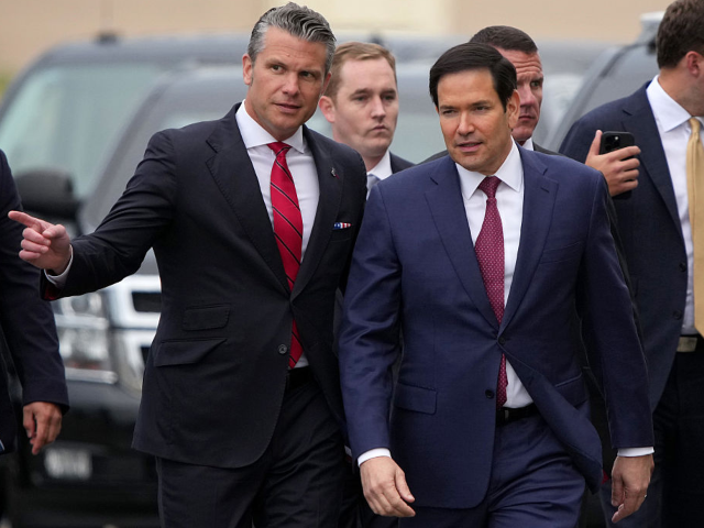 ANCHORAGE, ALASKA - AUGUST 15: U.S. Secretary of Defense Pete Hegseth (L) and U.S. Secreta