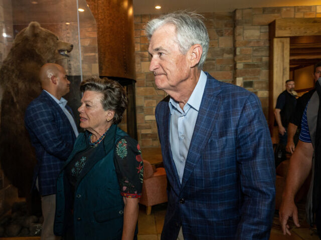 Jerome Powell, chairman of the US Federal Reserve, right, arrives for a dinner during the