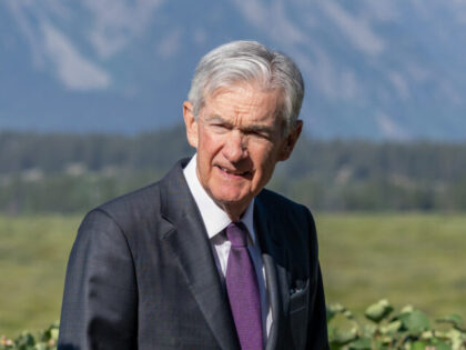 Jerome Powell, chairman of the US Federal Reserve, walks the grounds during the Kansas Cit