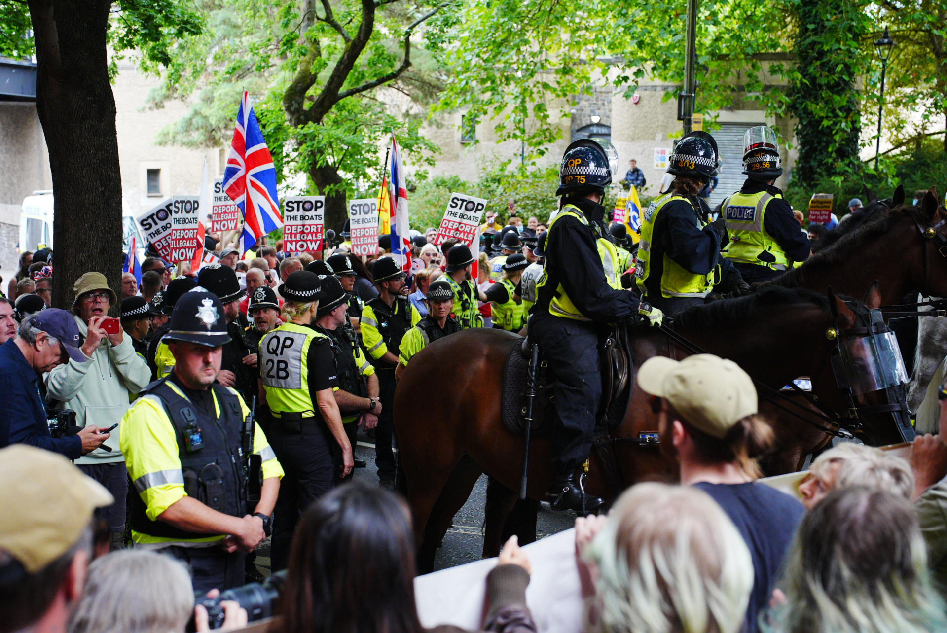 Mounted police officers are deployed during a protest by Abolish Asylum System and counter demonstrators at Castle Park in Bristol. Picture date: Saturday August 23, 2025. (Photo by Ben Birchall/PA Images via Getty Images)