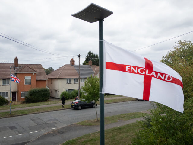 BIRMINGHAM, ENGLAND - AUGUST 18: A Union Flag and George Cross Flag fly above a residentia