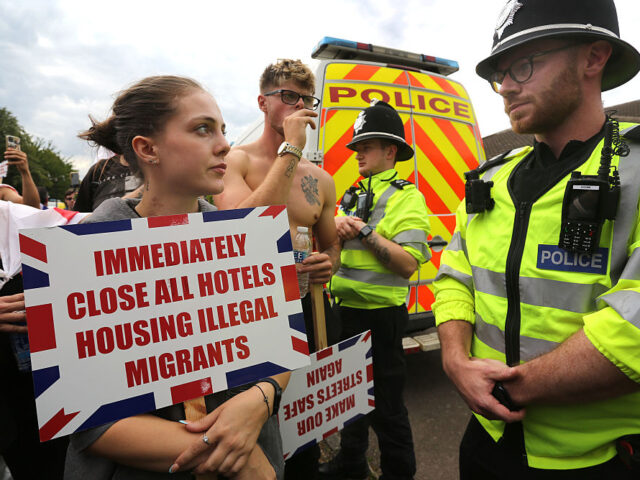 Anti-migrant Hotel Protest And Counter-Protests Take Place Across The UK NORWICH, ENGLAND - AUGUST 24: Protesters against the asylum hotel, rally in the car park o