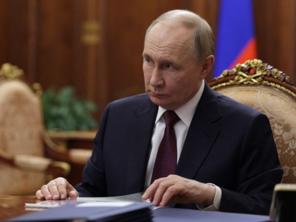 In this pool photograph distributed by the Russian state agency Sputnik, Russia's Presiden