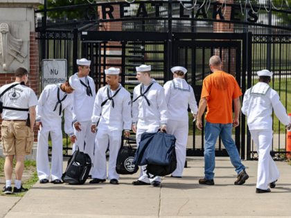GREAT LAKES, IL - AUGUST 29: Navy servicemen are dropped off at an entry gate at the Naval