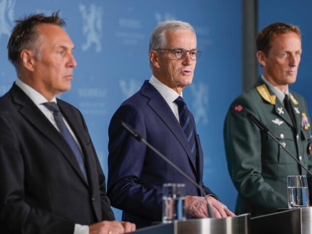 Norway's Prime Minister Jonas Gahr Store (C), Norway's Minister of Defence Tore Sandvik (L