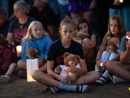 MINNEAPOLIS, MINNESOTA - AUGUST 27: People attend a vigil at Lynnhurst Park to mourn the d