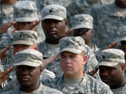 FORT STEWART, GA - AUGUST 16: Soldiers with the Army's 3rd Infantry Division salute during