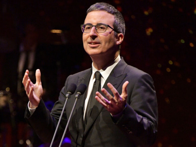 GettyImages-963638044 NEW YORK, NY - MAY 29: Comedian John Oliver speaks onstage during Lincoln Center's America
