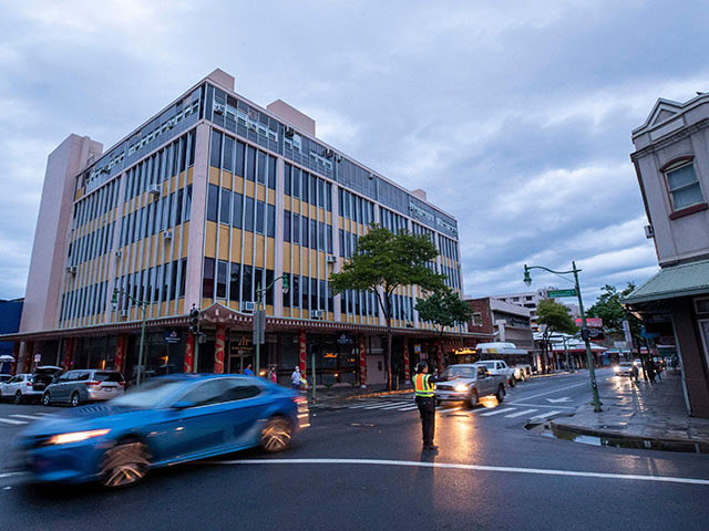 A Honolulu, Hawaii, police officer directs traffic in the Chinatown District on December 7