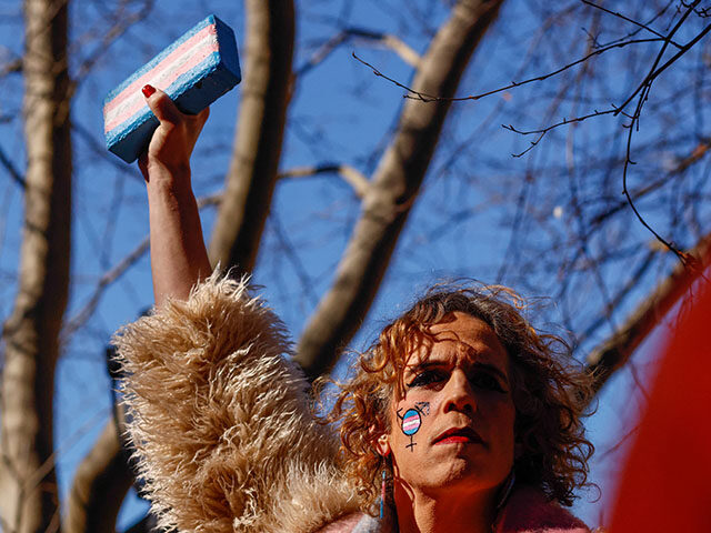 GettyImages2198942753 A person holds a brick during a protest outside the Stonewall Inn in New York, the scene o