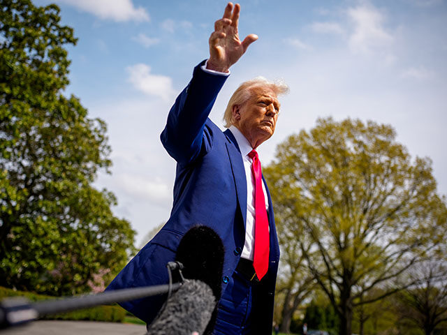 U.S. President Donald Trump gestures to members of the media before boarding Marine One on