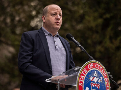Colorado Governor Jared Polis speaks during a community gathering at the site of an attack