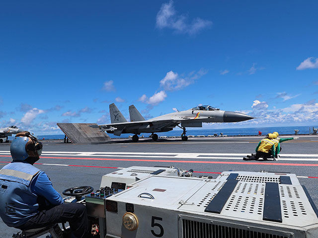 This photo shows fighter jets on Chinese aircraft carrier Shandong. China's naval formatio