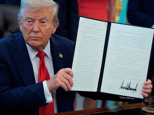 GettyImages2232036907 U.S. President Donald Trump signs executive orders in the Oval Office at the White House o