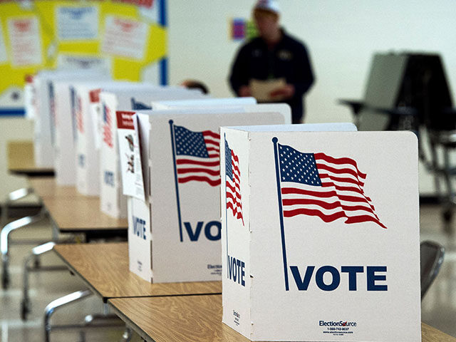 A man walks to use a voting booth March 1, 2016, at one of the Virginia primary election p
