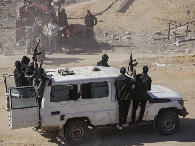 Hamas secures aid trucks (Jehad Alshrafi / Associated Press) Hamas fighters secure aid trucks that arrived the Gaza Strip, in Rafah, Tuesday, Jan. 21,