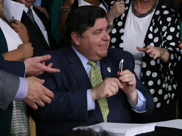 Illinois Gov. J.B. Pritzker signs into law a bill to legalize marijuana in Illinois next y