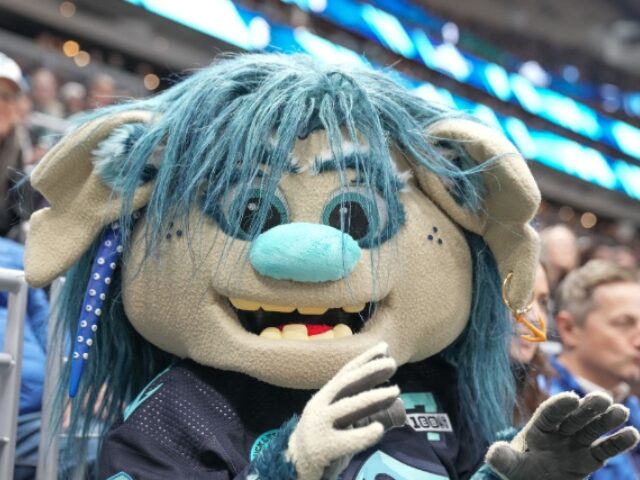 Jeff Halstead_Icon Sportswire via Getty Images SEATTLE, WA - MARCH 12: The Seattle Kraken mascot Buoy entertains the crowd before an NHL