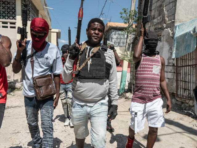 Gang Leader Jimmy 'Barbecue' Cherizier patrolling the streets with G-9 federatio