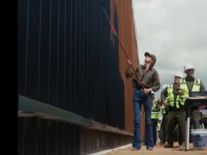 Kristi Noem, others painting border wall black
