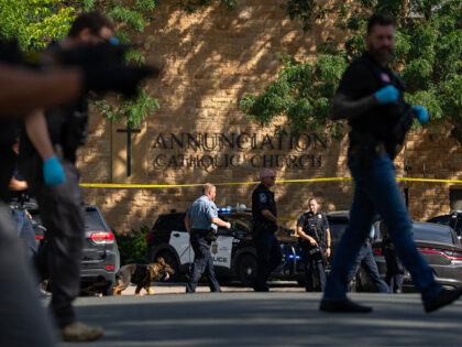 MINNEAPOLIS, MN. - AUGUST 2025: Law enforcement officers search the nearby neighborhood to
